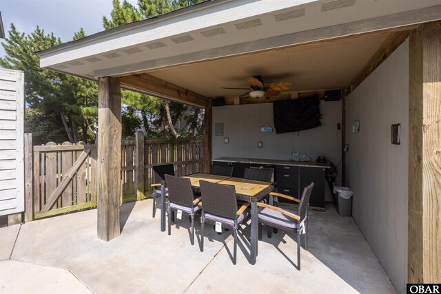 1024 Lighthouse Dr Lot 14, Corolla, NC 27927 - view of patio / terrace with a ceiling fan, outdoor dining area, and a gate