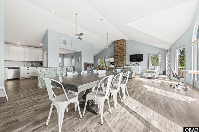 1024 Lighthouse Dr Lot 14, Corolla, NC 27927 - dining space with ceiling fan, wood finished floors, high vaulted ceiling, and recessed lighting