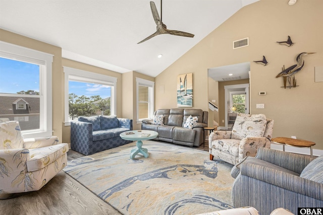 living area featuring recessed lighting, visible vents, ceiling fan, wood finished floors, and high vaulted ceiling