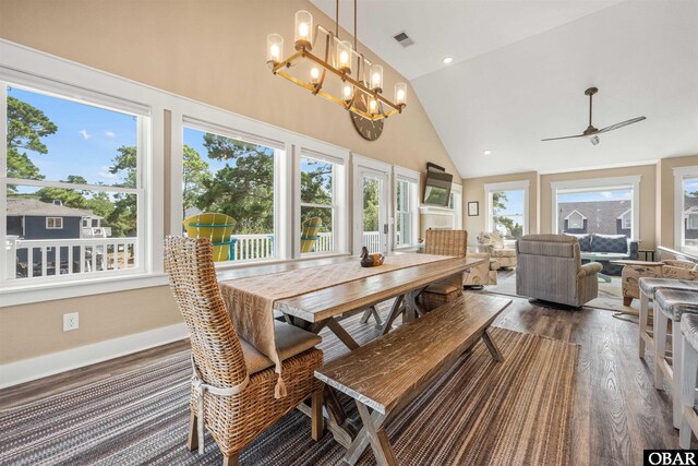 dining room featuring baseboards, visible vents, dark wood finished floors, high vaulted ceiling, and recessed lighting