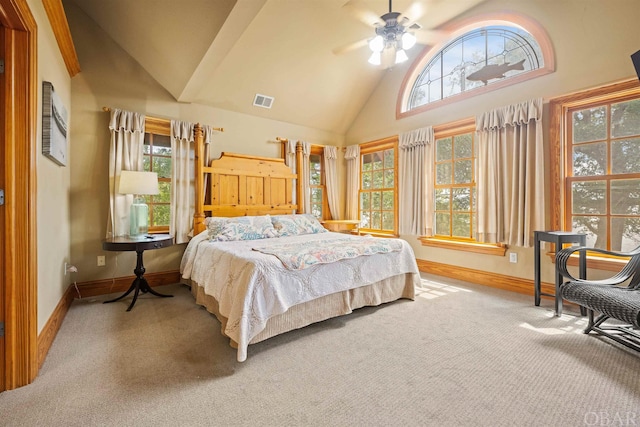 bedroom featuring light carpet, high vaulted ceiling, multiple windows, and visible vents