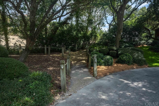 exterior space with driveway and a gated entry