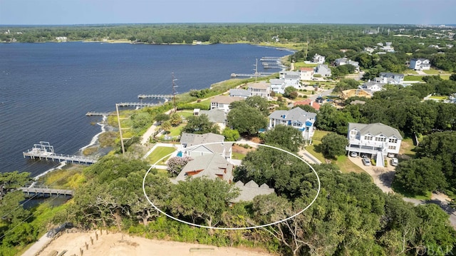 drone / aerial view featuring a residential view and a water view