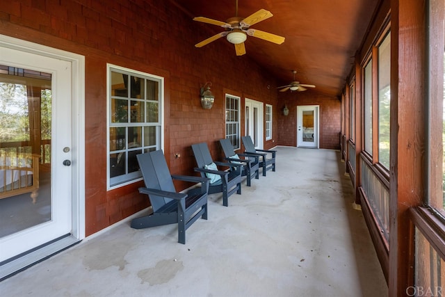 sunroom / solarium featuring lofted ceiling