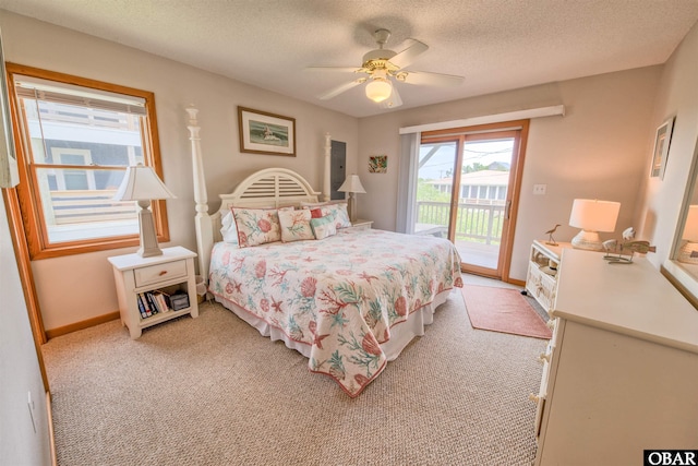 58208 Sand Rd Lot 19, Hatteras, NC 27943 - bedroom featuring access to exterior, light carpet, a textured ceiling, and ceiling fan