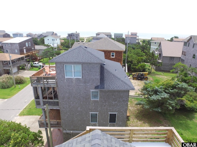 58208 Sand Rd Lot 19, Hatteras, NC 27943 - back of property with a shingled roof and a residential view