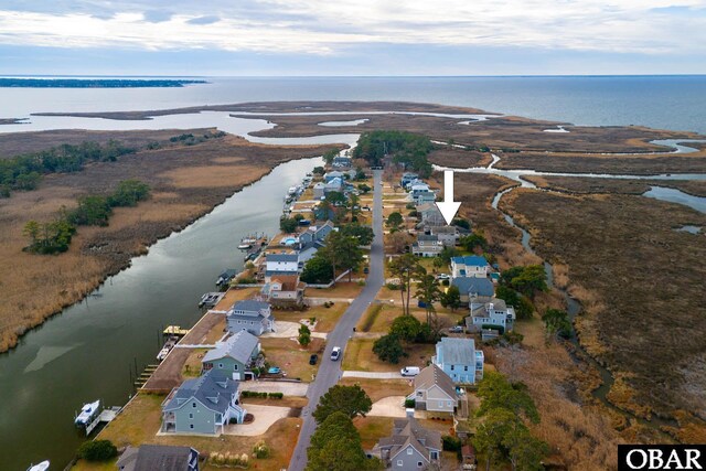 birds eye view of property featuring a residential view and a water view