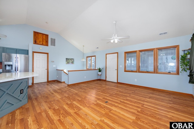 unfurnished living room with light wood finished floors, baseboards, visible vents, and a ceiling fan