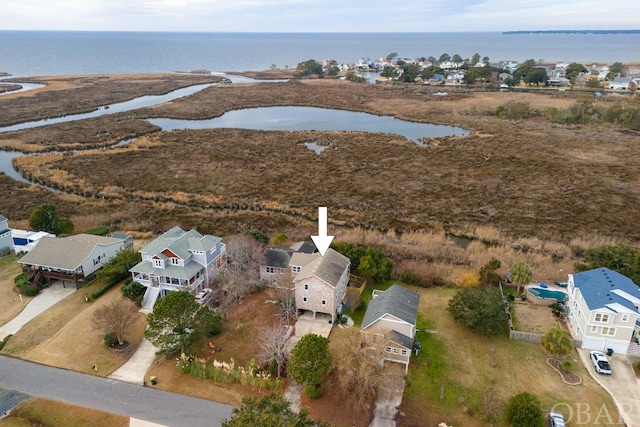 birds eye view of property featuring a water view and a residential view