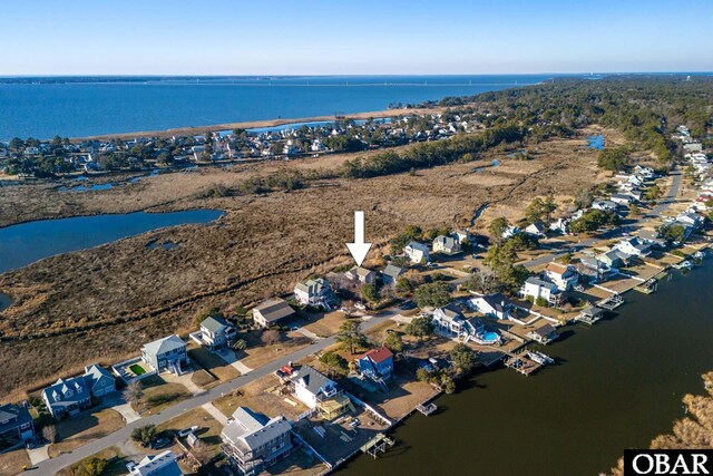 bird's eye view featuring a water view and a residential view