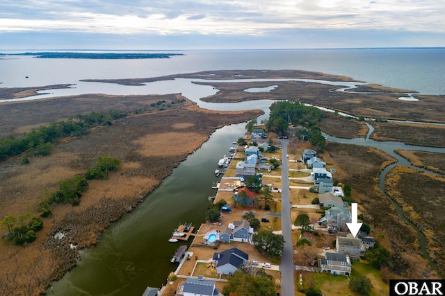 aerial view with a water view and a residential view