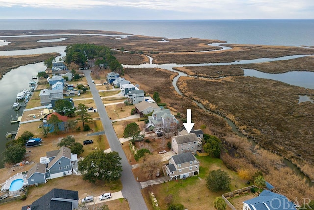 bird's eye view with a water view and a residential view