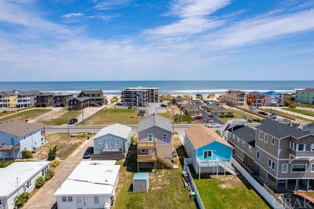 bird's eye view featuring a water view and a residential view