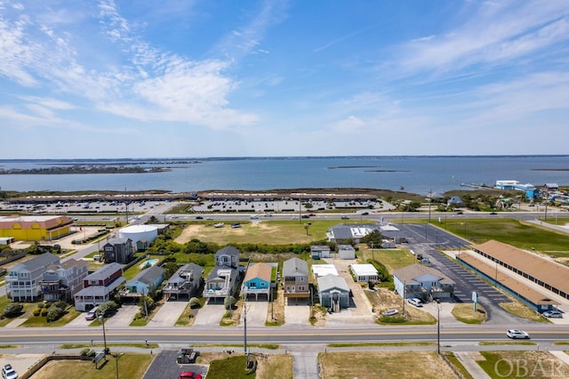 birds eye view of property with a residential view and a water view