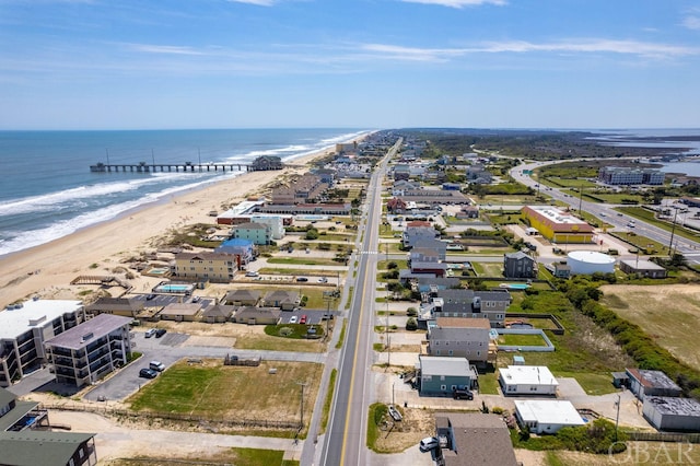 bird's eye view featuring a water view and a view of the beach