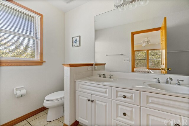 full bath featuring plenty of natural light, a sink, and tile patterned floors