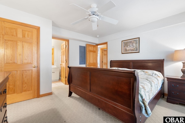 754 Cormorant Trl Lot 79, Corolla, NC 27927 - bedroom featuring light colored carpet, ensuite bathroom, and a ceiling fan