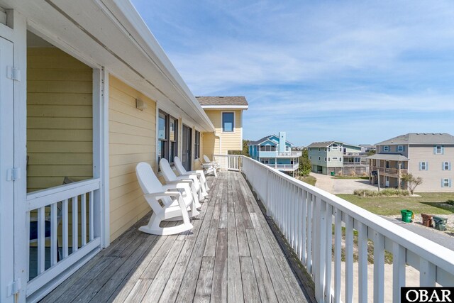 wooden deck with a residential view