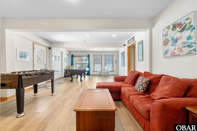 living room featuring light wood-type flooring and recessed lighting