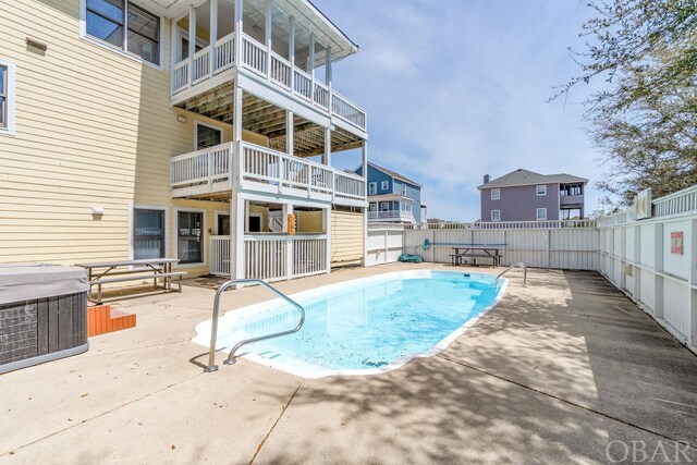 view of pool featuring a fenced backyard, a fenced in pool, and a patio