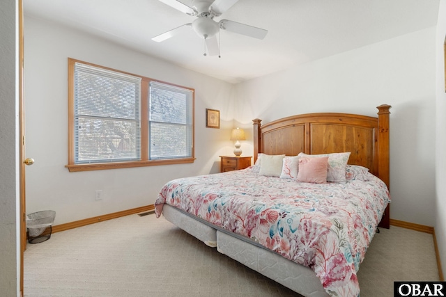 bedroom with carpet floors, baseboards, visible vents, and ceiling fan