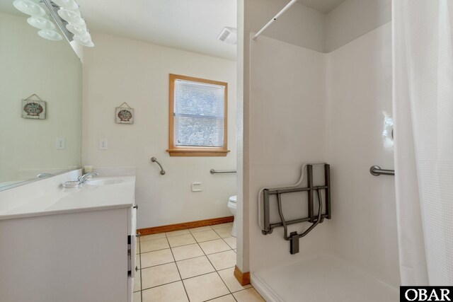 bathroom featuring visible vents, a shower with shower curtain, toilet, vanity, and tile patterned flooring