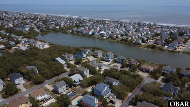 aerial view featuring a water view and a residential view