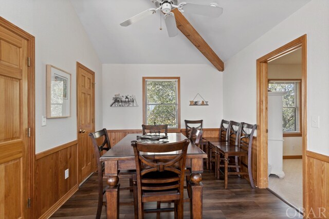 754 Cormorant Trl Lot 79, Corolla, NC 27927 - dining area with lofted ceiling, a wainscoted wall, dark wood-type flooring, wood walls, and ceiling fan