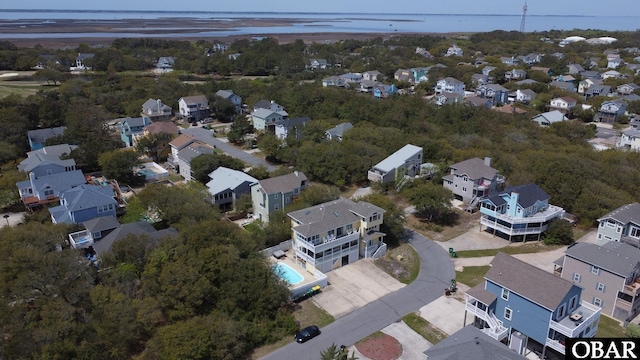 birds eye view of property featuring a water view and a residential view