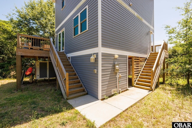102 Prince Charles Ct Lot 47, Kill Devil Hills, NC 27948 - view of property exterior with stairway and a wooden deck