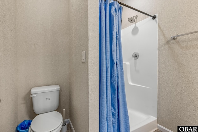 102 Prince Charles Ct Lot 47, Kill Devil Hills, NC 27948 - bathroom with a stall shower, toilet, and a textured wall