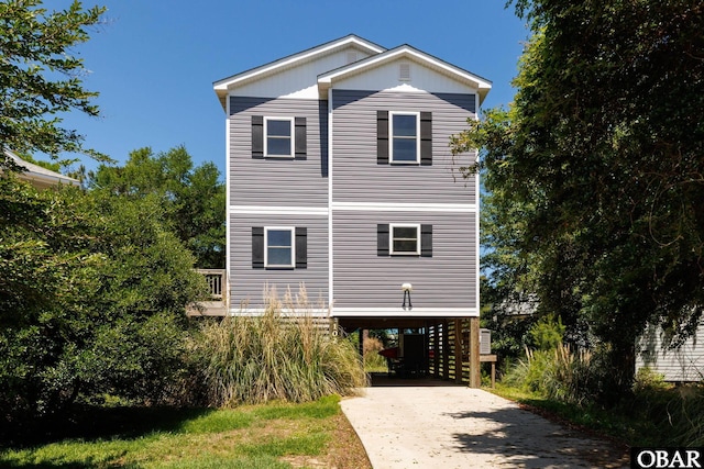 102 Prince Charles Ct Lot 47, Kill Devil Hills, NC 27948 - view of side of home with a carport and driveway