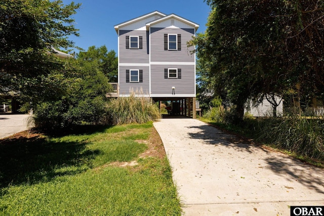 102 Prince Charles Ct Lot 47, Kill Devil Hills, NC 27948 - beach home featuring driveway, a carport, and a front lawn