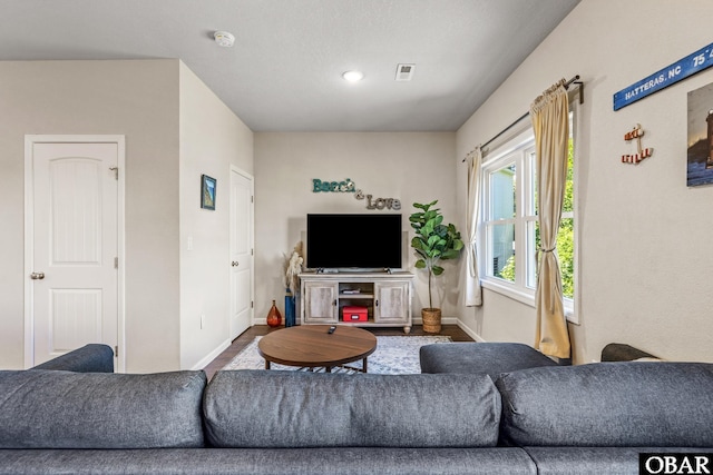 102 Prince Charles Ct Lot 47, Kill Devil Hills, NC 27948 - living area featuring baseboards and wood finished floors