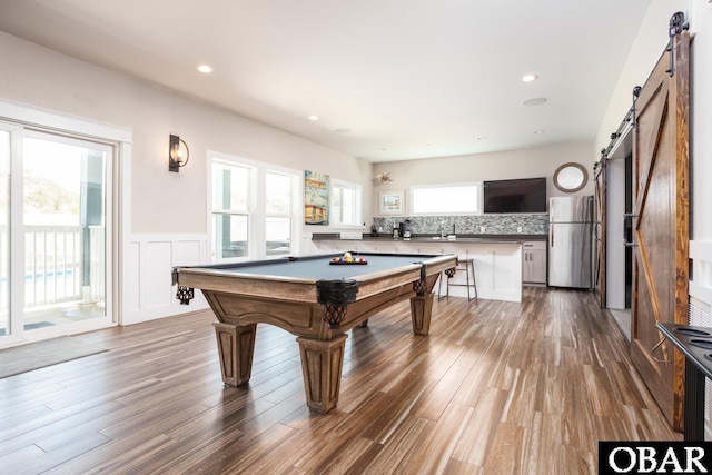 909 Lighthouse Dr Lot # 8, Corolla, NC 27927 - recreation room featuring a barn door, a wainscoted wall, dark wood-style flooring, billiards table, and recessed lighting