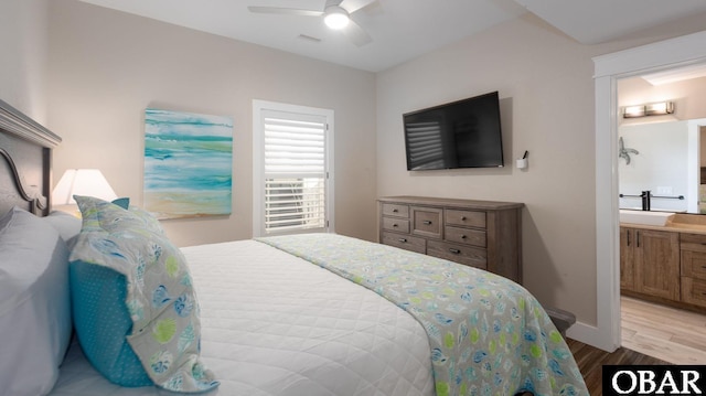 909 Lighthouse Dr Lot # 8, Corolla, NC 27927 - bedroom with wood finished floors, connected bathroom, and ceiling fan