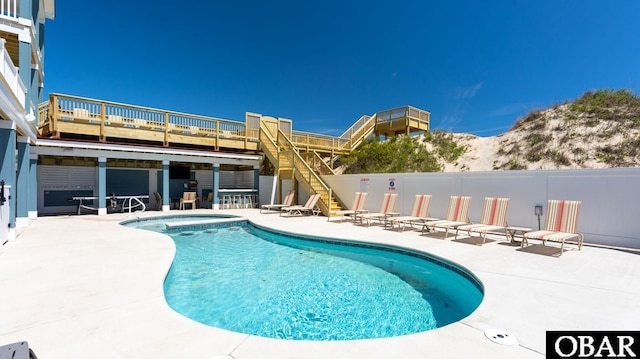 909 Lighthouse Dr Lot # 8, Corolla, NC 27927 - community pool featuring a patio, stairs, a wooden deck, and a community hot tub