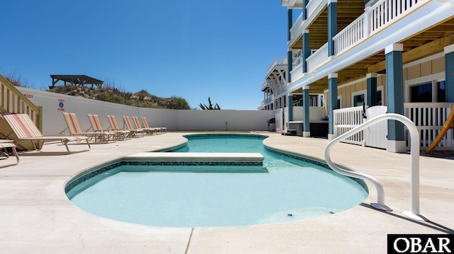 909 Lighthouse Dr Lot # 8, Corolla, NC 27927 - community pool featuring a patio area