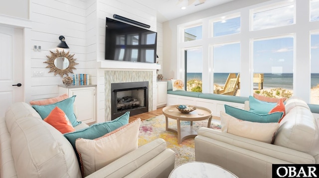 909 Lighthouse Dr Lot # 8, Corolla, NC 27927 - living room featuring a fireplace and light wood-type flooring