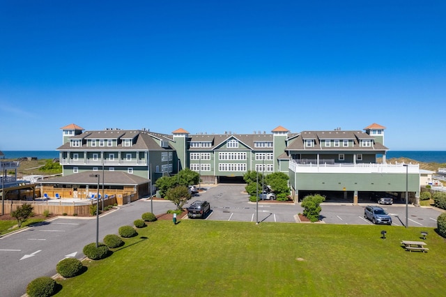 bird's eye view featuring a water view and a residential view