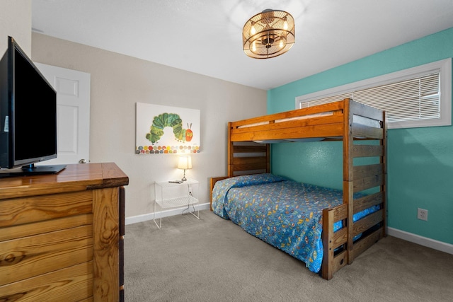 1386B Duck Rd Lot 34, Duck, NC 27949 - carpeted bedroom featuring baseboards and an inviting chandelier