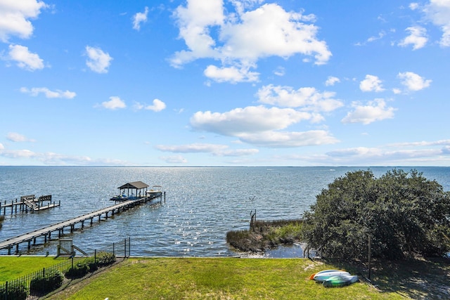 1386B Duck Rd Lot 34, Duck, NC 27949 - view of dock featuring boat lift, fence, a water view, and a yard