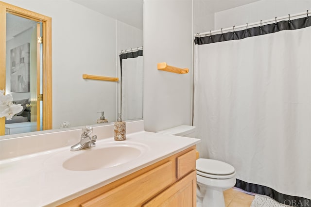 full bath featuring toilet, tile patterned flooring, and vanity