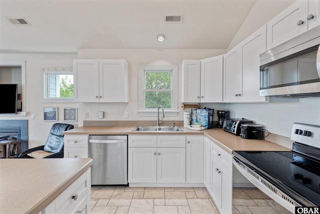 759 Ridge Point Dr Lot 42, Corolla, NC 27927 - kitchen with appliances with stainless steel finishes, a sink, healthy amount of natural light, light countertops, and vaulted ceiling
