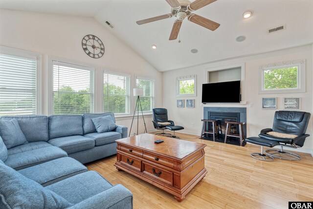 759 Ridge Point Dr Lot 42, Corolla, NC 27927 - living area with a fireplace with flush hearth, vaulted ceiling, plenty of natural light, a ceiling fan, and recessed lighting