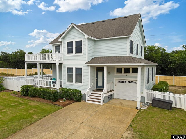 759 Ridge Point Dr Lot 42, Corolla, NC 27927 - view of front of property with an attached garage, a shingled roof, a balcony, and concrete driveway