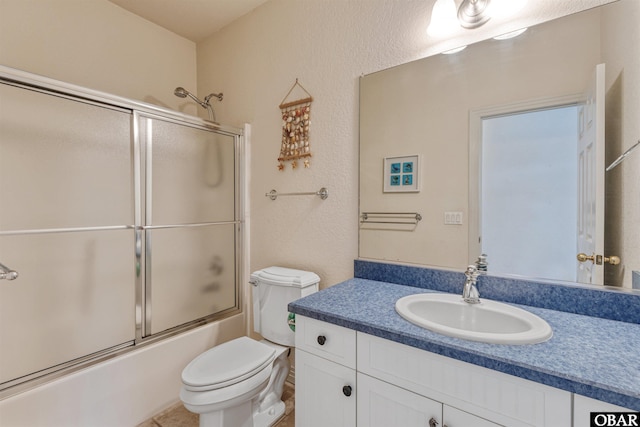 759 Ridge Point Dr Lot 42, Corolla, NC 27927 - bathroom with bath / shower combo with glass door, toilet, and vanity
