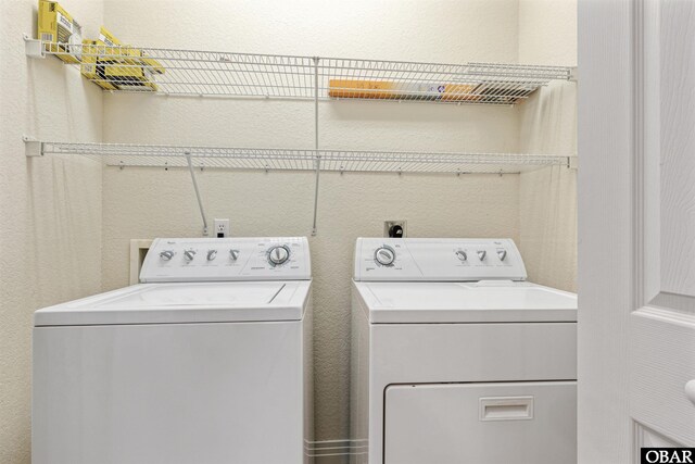 759 Ridge Point Dr Lot 42, Corolla, NC 27927 - clothes washing area with washer and clothes dryer and a textured wall