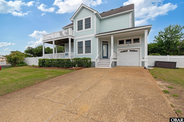 759 Ridge Point Dr Lot 42, Corolla, NC 27927 - view of front of house with driveway, covered porch, a balcony, and a shingled roof