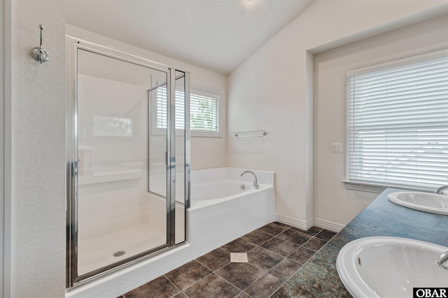 759 Ridge Point Dr Lot 42, Corolla, NC 27927 - full bathroom with a sink, a shower stall, a garden tub, vaulted ceiling, and baseboards